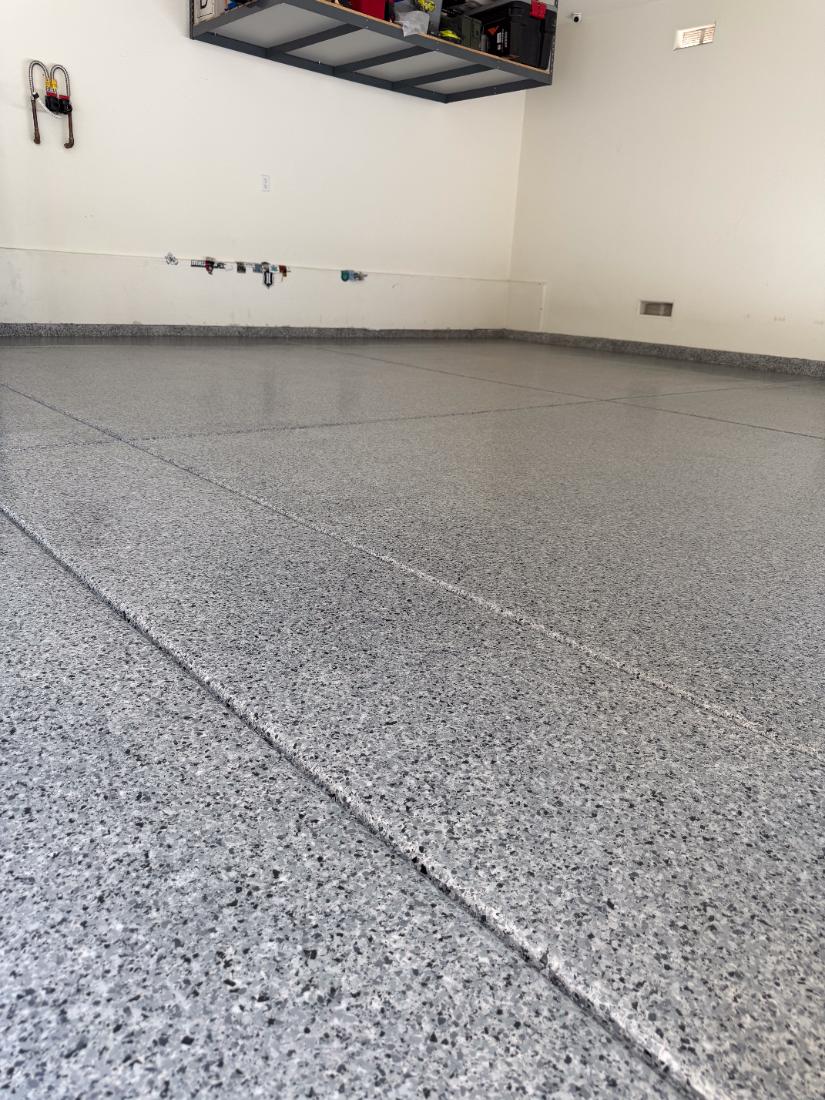 Grey flake epoxy garage floor in Henderson, NV by Tabwa Coatings