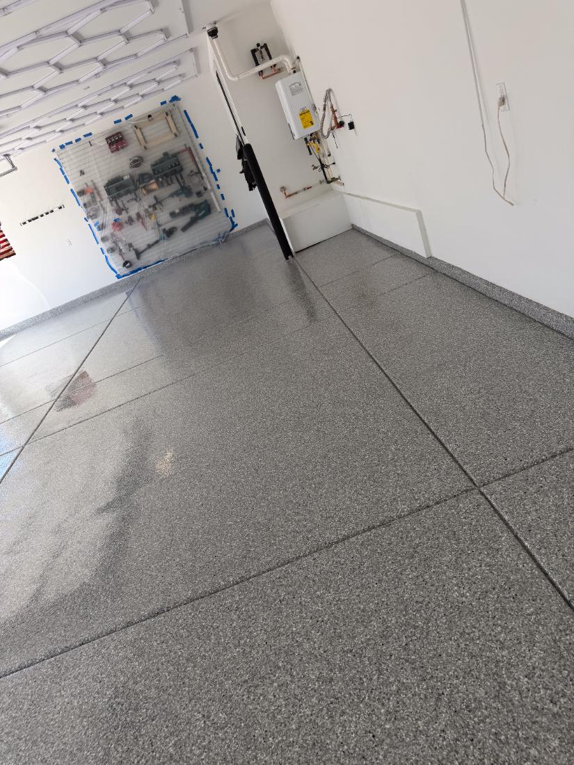Grey flake epoxy floor with coated stem wall, Las Vegas by Tabwa Coatings