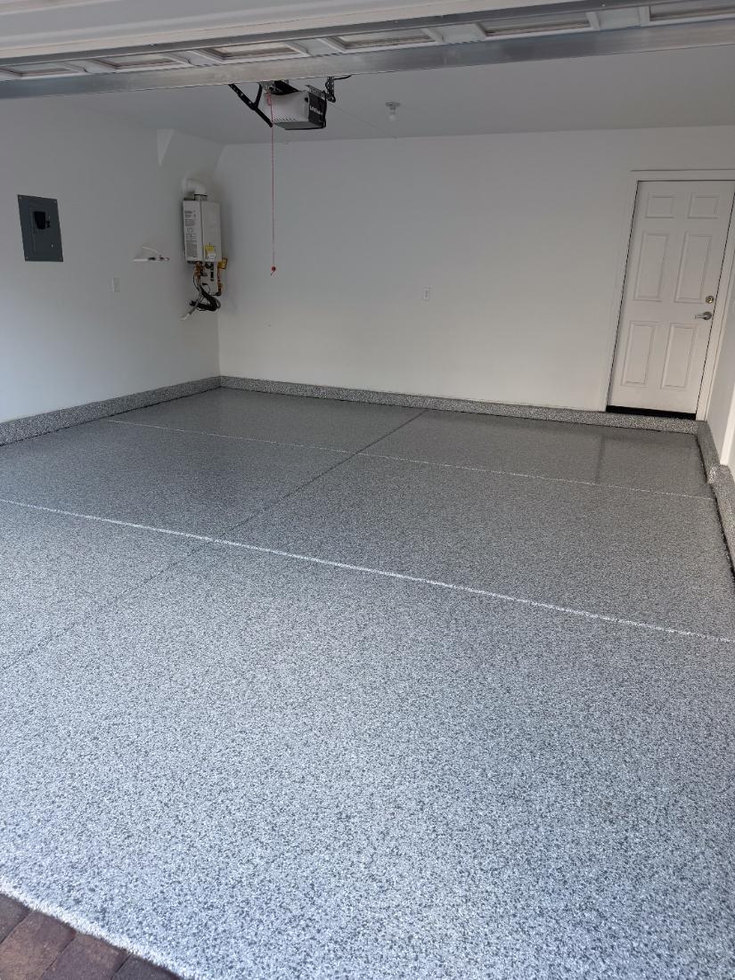 After: grey flake epoxy garage floor in Las Vegas by Tabwa Coatings